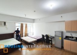 semi-furnished studio unit at the meranti of two serendra
