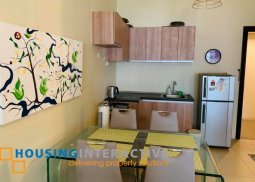 fully furnished 1-bedroom unit with a balcony for sale in avida towers 34th