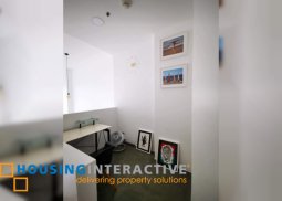 fully furnished 1-bedroom loft unit with balcony for sale in one rockwell