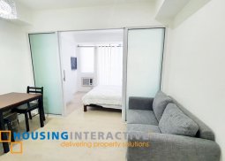 fully furnished 1-bedroom unit with balcony for rent in azure urban resort