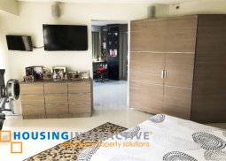 semi-furnished 2-bedroom unit with balcony for sale in ritz tower