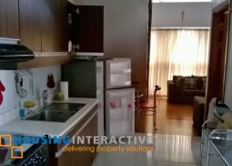 furnished 2-bedroom unit with balcony in eton residences for rent