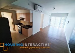 bare 2-bedroom unit with balcony for rent/sale in the sandstone at portico