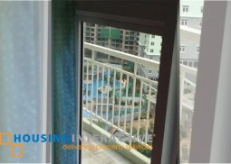 semi-furnished 2-bedroom unit with balcony for rent in two serendra