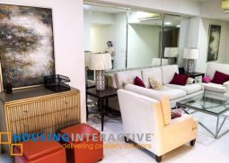 a 2 bedrooms with balcony in arya residences bgc.