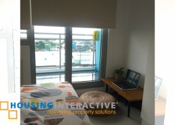 fully furnished 2-bedroom unit with balcony for rent in azure urban resort