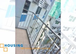 semi furnished 2-bedroom unit with balcony for sale in trion towers