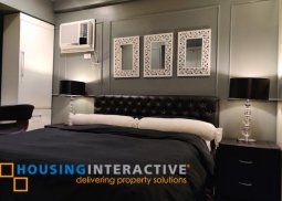 a semi-furnished 2 bedroom unit for sale in the columns ayala