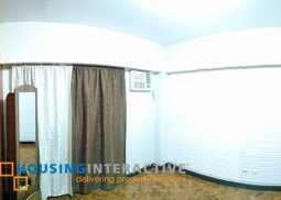 a semi-furnished  2 bedroom unit for rent in tivoli garden residences
