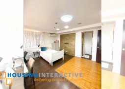 a semi furnished 2 bedroom unit for sale in mckinley hill garden villas