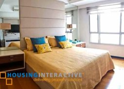 fully furnished 2-bedroom unit with balcony for rent at one serendra