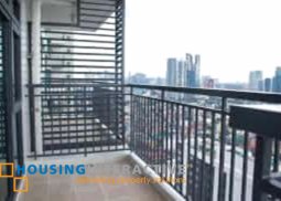 mid-century 1-bedroom unit with balcony for rent in solstice tower