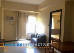 fully furnished 1-bedroom unit with balcony for sale in the radiance