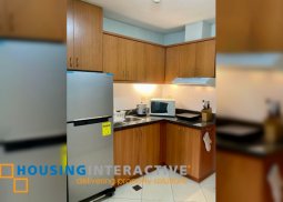 modern studio with a usable balcony.