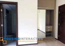 semi furnished 2-bedroom unit with balcony for rent in trion towers