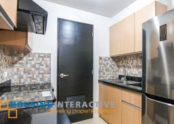 fully furnished 1-bedroom unit with balcony for sale in two serendra