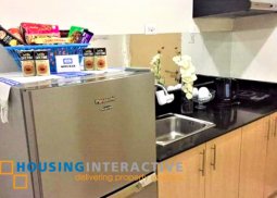 fully furnished 1-bedroom unit with balcony for sale in wind residences