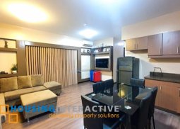 fully furnished 2-bedroom unit with balcony & parking for sale in rhapsody residences