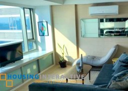 fully furnished 2-bedroom unit with parking & balcony for sale in alphaland makati