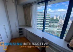 fully furnished 2-bedroom loft unit with parking for sale in one rockwell