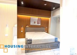 a 1 br brandnew fully furnished, newly interior designed condo unit with parking