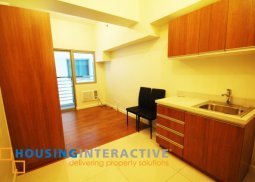 unfurnished studio type condo unit for sale at the eton tower makati