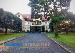 4-level rustic mediterranean mansion with porte-cochere for sale in buck estate, alfonso cavite