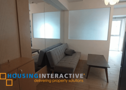 a fully furnished studio unit with balcony for rent in the venice luxury residences