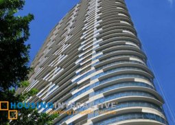 semi-furnished 2br unit with balcony and parking for sale in one rockwell