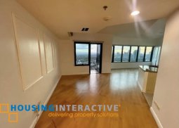 semi-furnished 2br unit with parking for sale in one rockwell