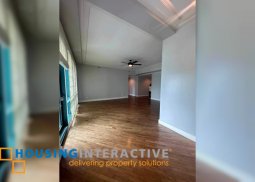 semi-furnished 2br unit with parking for rent in amorsolo square