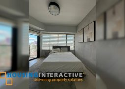 fully furnished 2br unit with parking for sale in one rockwell