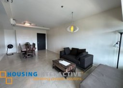 semi-furnished 2br unit with balcony and parking for sale in the residences at greenbelt