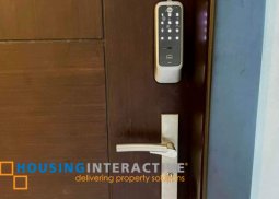 a condominium for sale in uptown parksuites taguig city