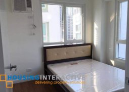 a condominium for sale in the grand midori makati city