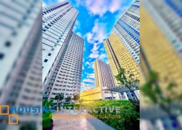 a condominium for sale in grass residences quezon city