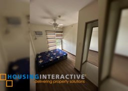 bare 2br unit with balcony and parking for sale in acacia estates
