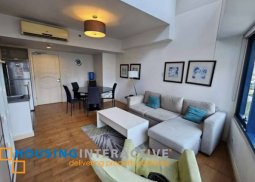fully furnished 2br unit with balcony and parking for sale in one rockwell