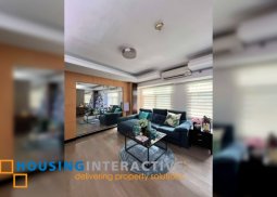 semi-furnished 2br unit with balcony and parking for sale in one serendra