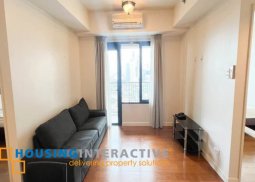 semi-furnished 2br unit with parking for sale in one rockwell