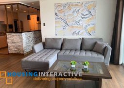 fully furnished 2br unit with balcony for sale in st. francis shangri-la place