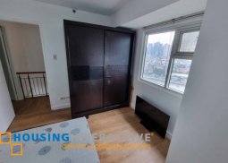 a 2-level, 2-bedroom apartment located in mandaluyong