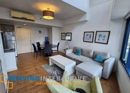 fully furnished 2br unit with parking for sale in one rockwell