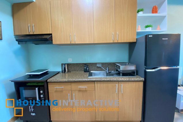 fully furnished 1br unit with balcony for rent in trion towers