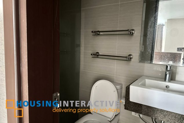 furnished 1br unit with parking for sale in two central