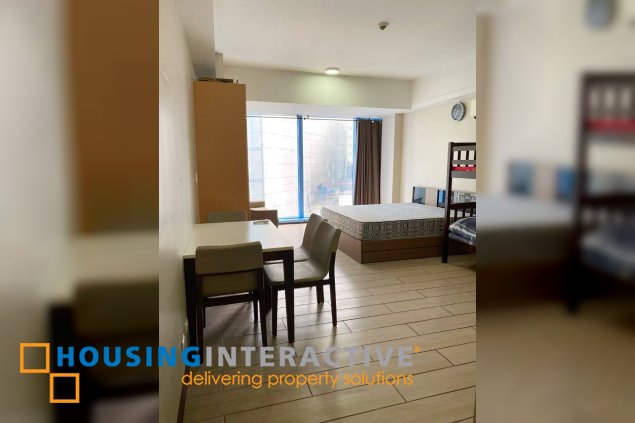 furnished studio unit with parking for sale in three central