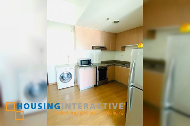 nicely furnished 1br unit with balcony for sale in st. francis shangri-la place