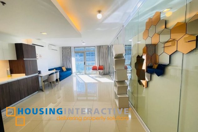 semi-furnished 2br unit with balcony and parking for sale in east gallery place