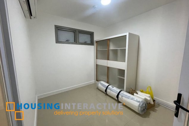 semi-furnished 2br unit with balcony and parking for sale in east gallery place