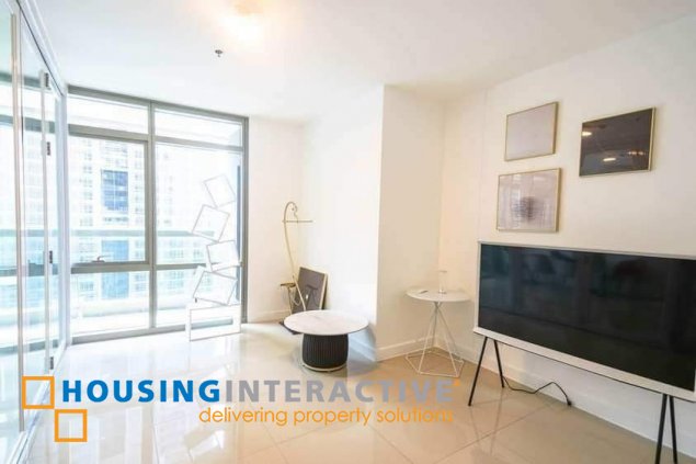 semi-furnished 2br unit with balcony and parking for sale in east gallery place